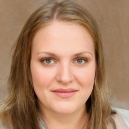 Joyful white young-adult female with medium  brown hair and blue eyes