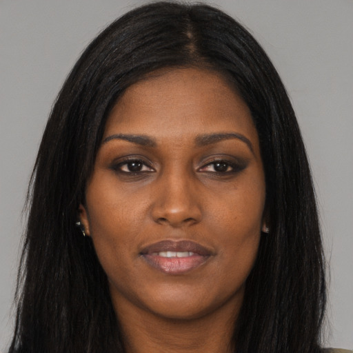 Joyful asian young-adult female with long  black hair and brown eyes