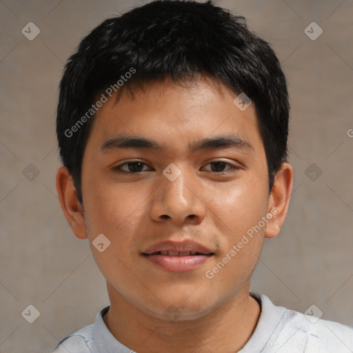 Joyful asian young-adult male with short  brown hair and brown eyes