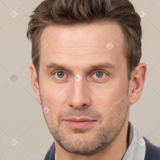 Joyful white adult male with short  brown hair and grey eyes