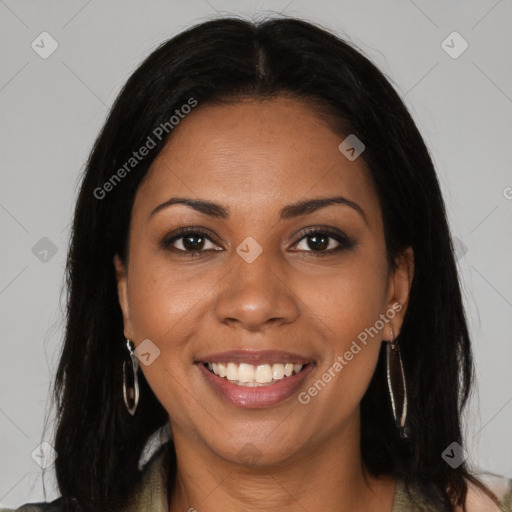 Joyful black young-adult female with long  brown hair and brown eyes