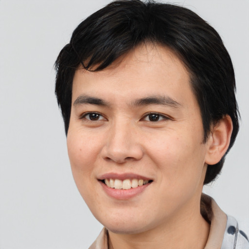 Joyful white young-adult male with medium  brown hair and brown eyes