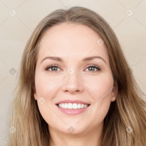 Joyful white young-adult female with long  brown hair and blue eyes