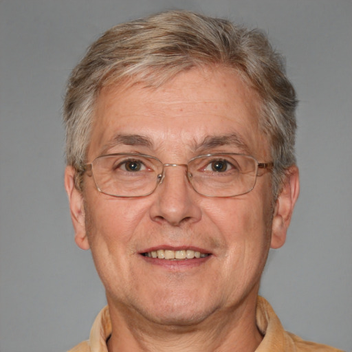 Joyful white middle-aged male with short  gray hair and brown eyes