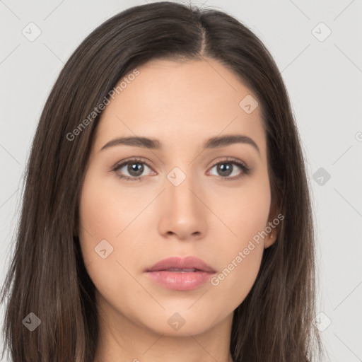 Neutral white young-adult female with long  brown hair and brown eyes