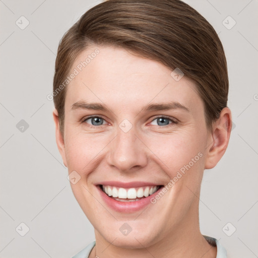 Joyful white young-adult female with short  brown hair and grey eyes