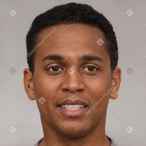 Joyful black young-adult male with short  brown hair and brown eyes