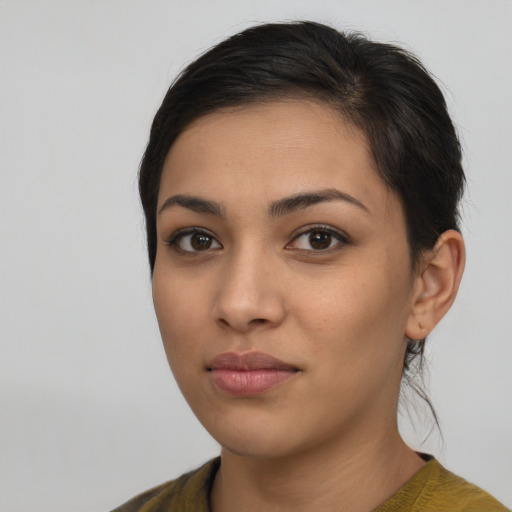 Neutral latino young-adult female with medium  brown hair and brown eyes