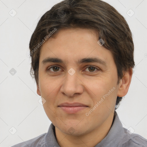 Joyful white adult male with short  brown hair and brown eyes