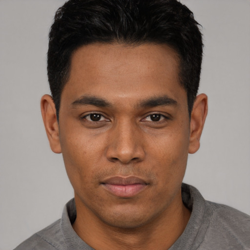 Neutral latino young-adult male with short  black hair and brown eyes