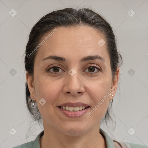 Joyful white adult female with medium  brown hair and brown eyes