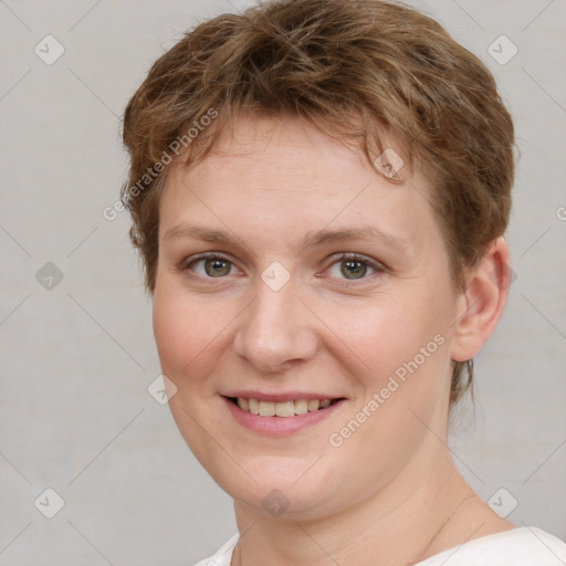 Joyful white young-adult female with short  brown hair and grey eyes