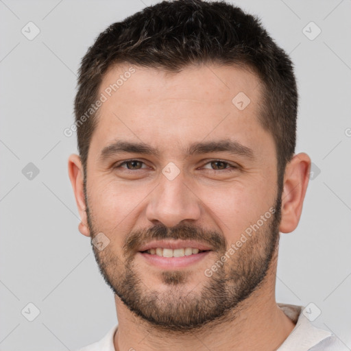 Joyful white young-adult male with short  brown hair and brown eyes