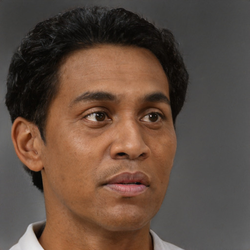 Neutral black adult male with short  brown hair and brown eyes