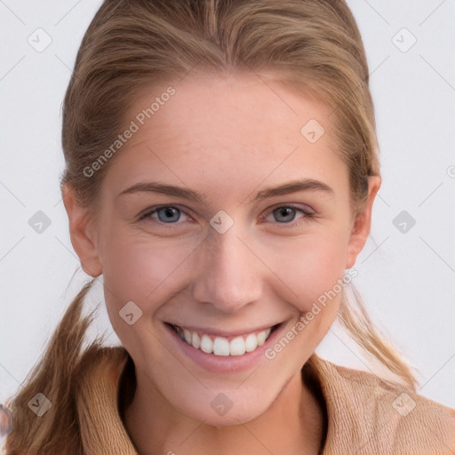 Joyful white young-adult female with long  brown hair and blue eyes