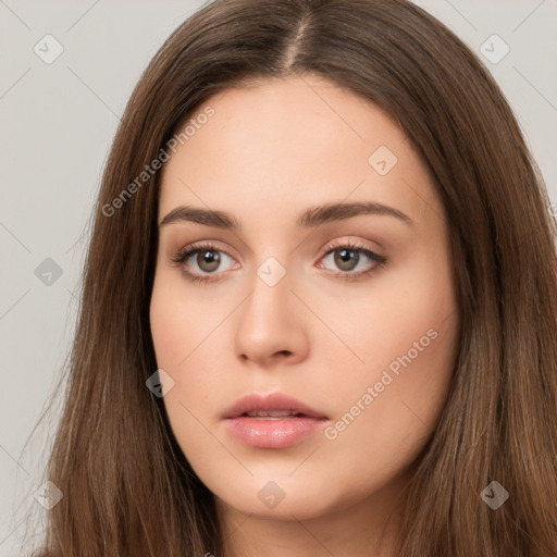 Neutral white young-adult female with long  brown hair and brown eyes