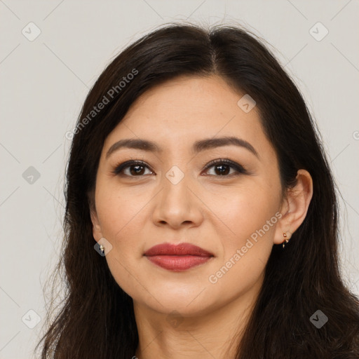 Joyful latino young-adult female with long  brown hair and brown eyes