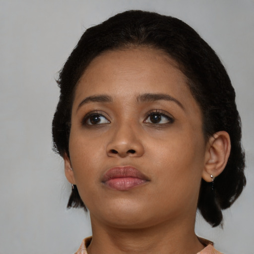 Neutral black young-adult female with medium  black hair and brown eyes