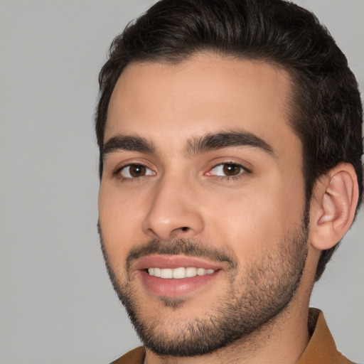 Joyful white young-adult male with short  brown hair and brown eyes