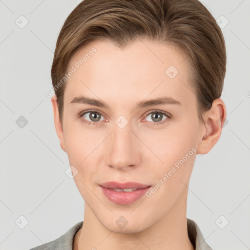 Joyful white young-adult female with short  brown hair and grey eyes