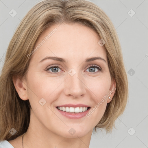 Joyful white young-adult female with medium  brown hair and blue eyes