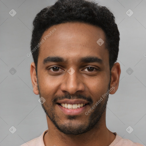 Joyful black young-adult male with short  black hair and brown eyes