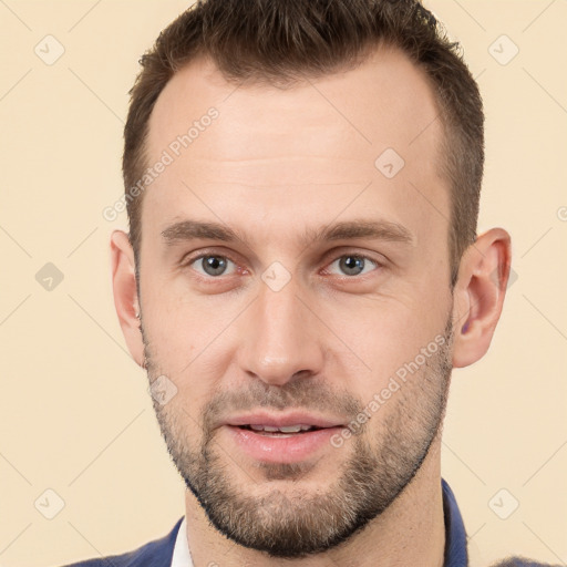 Joyful white young-adult male with short  brown hair and brown eyes