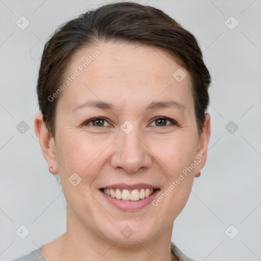 Joyful white young-adult female with short  brown hair and brown eyes