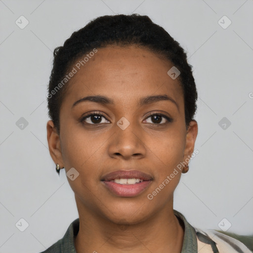 Joyful black young-adult female with short  black hair and brown eyes