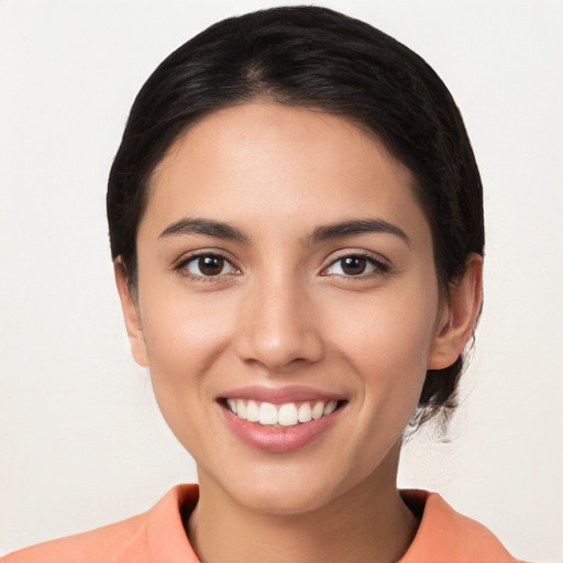 Joyful white young-adult female with medium  brown hair and brown eyes