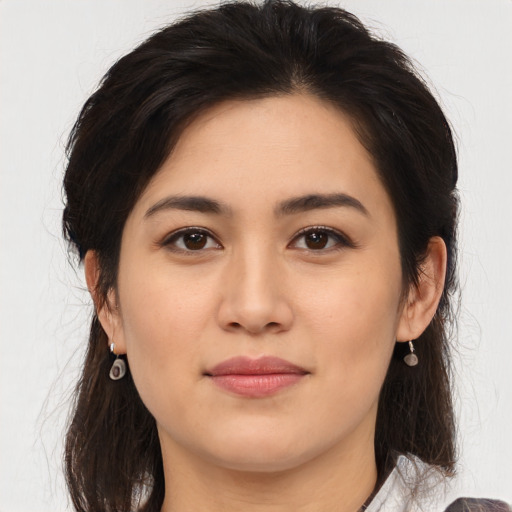 Joyful asian young-adult female with medium  brown hair and brown eyes