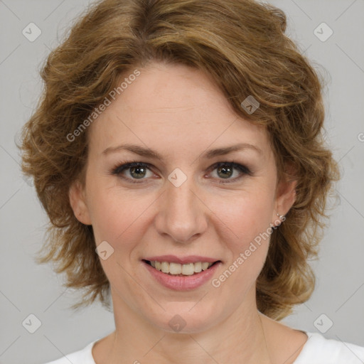 Joyful white adult female with medium  brown hair and green eyes