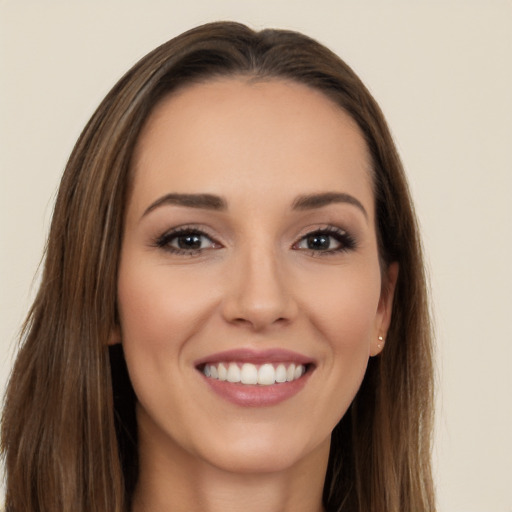 Joyful white young-adult female with long  brown hair and brown eyes