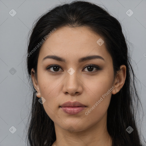 Joyful latino young-adult female with long  brown hair and brown eyes