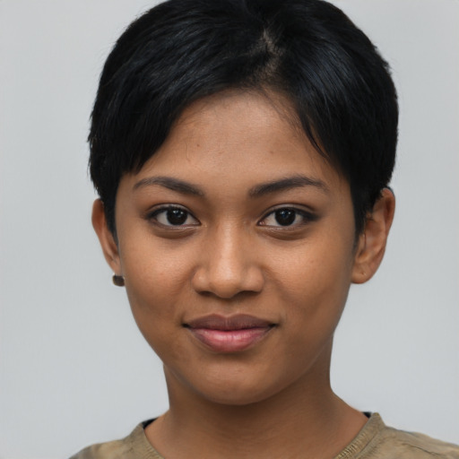 Joyful asian young-adult female with short  black hair and brown eyes