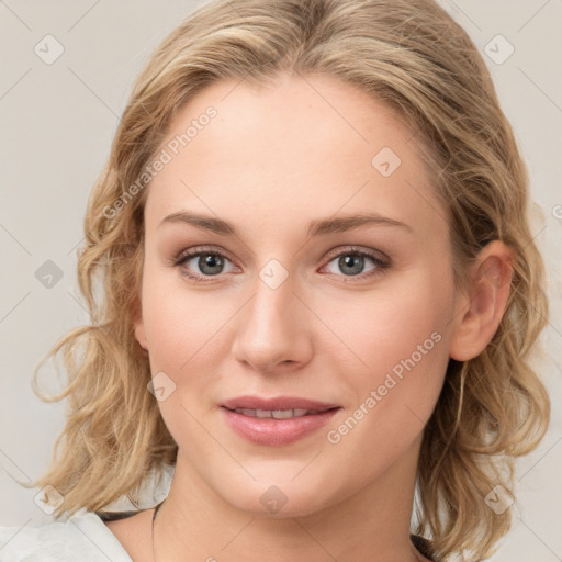 Joyful white young-adult female with medium  brown hair and blue eyes