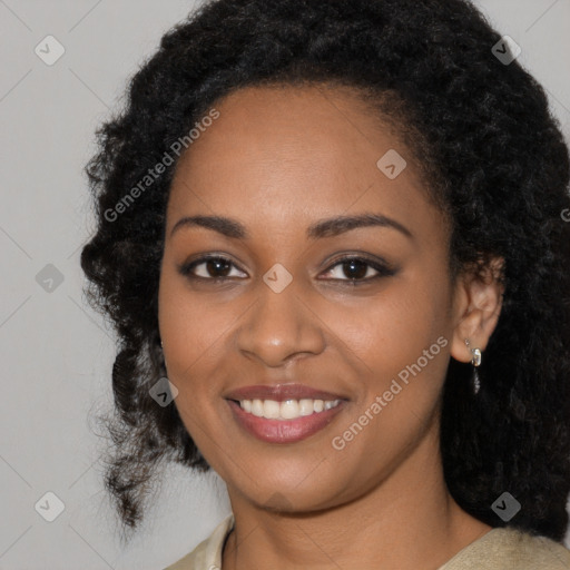 Joyful black young-adult female with medium  black hair and brown eyes