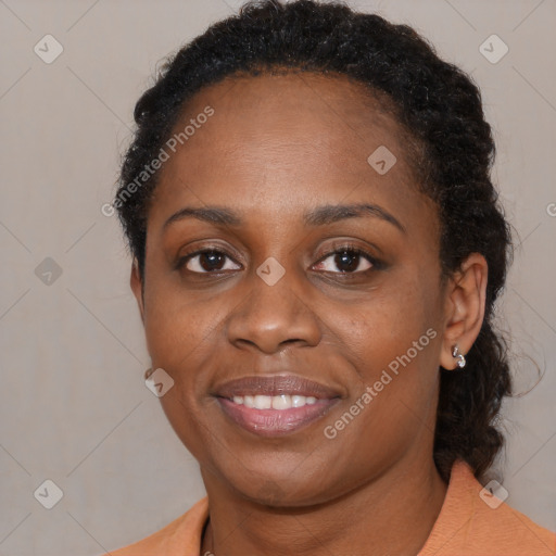 Joyful black young-adult female with medium  brown hair and brown eyes