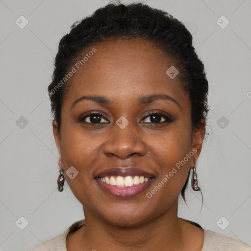 Joyful black young-adult female with short  brown hair and brown eyes