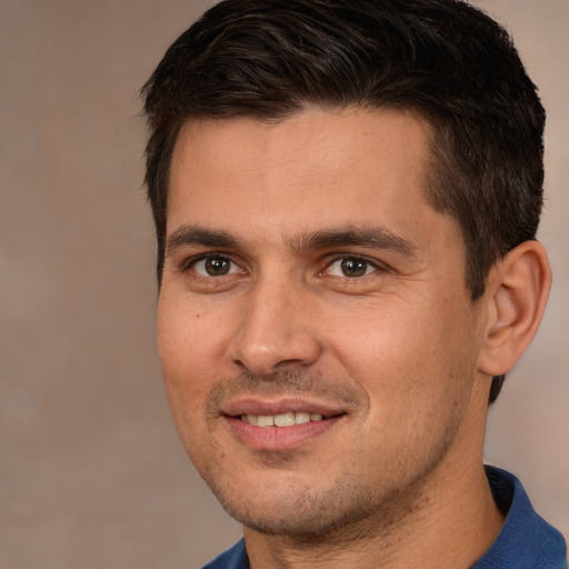 Joyful white young-adult male with short  brown hair and brown eyes