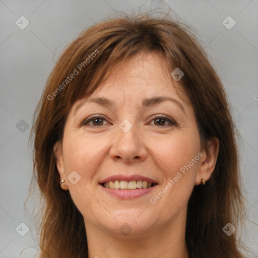 Joyful white adult female with medium  brown hair and brown eyes