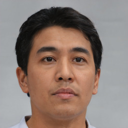 Neutral asian young-adult male with short  brown hair and brown eyes