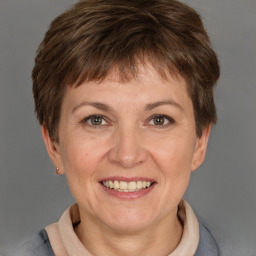 Joyful white adult female with short  brown hair and brown eyes