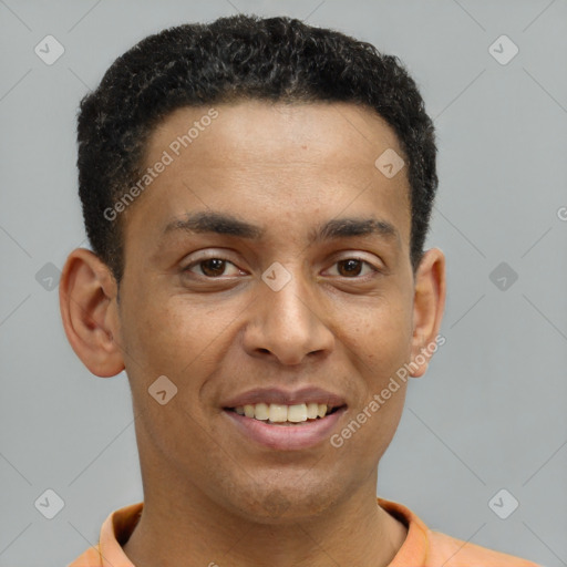 Joyful latino young-adult male with short  brown hair and brown eyes