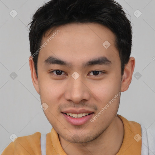 Joyful asian young-adult male with short  brown hair and brown eyes