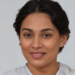 Joyful white adult female with medium  brown hair and brown eyes