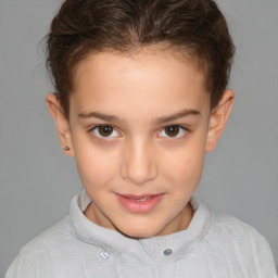 Joyful white child female with short  brown hair and brown eyes