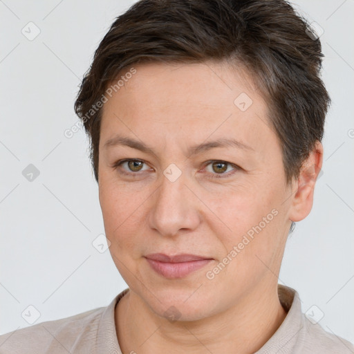 Joyful white adult female with short  brown hair and brown eyes