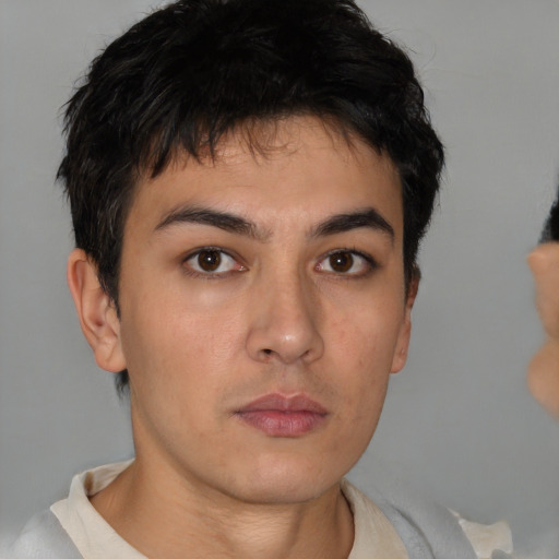 Neutral white young-adult male with short  black hair and brown eyes