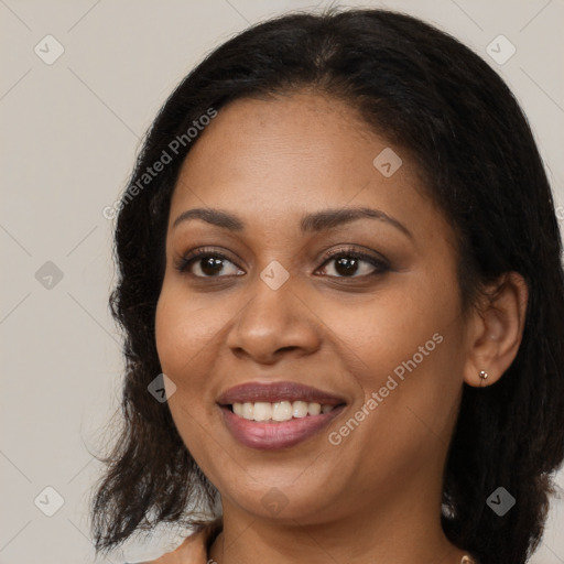 Joyful black young-adult female with medium  brown hair and brown eyes